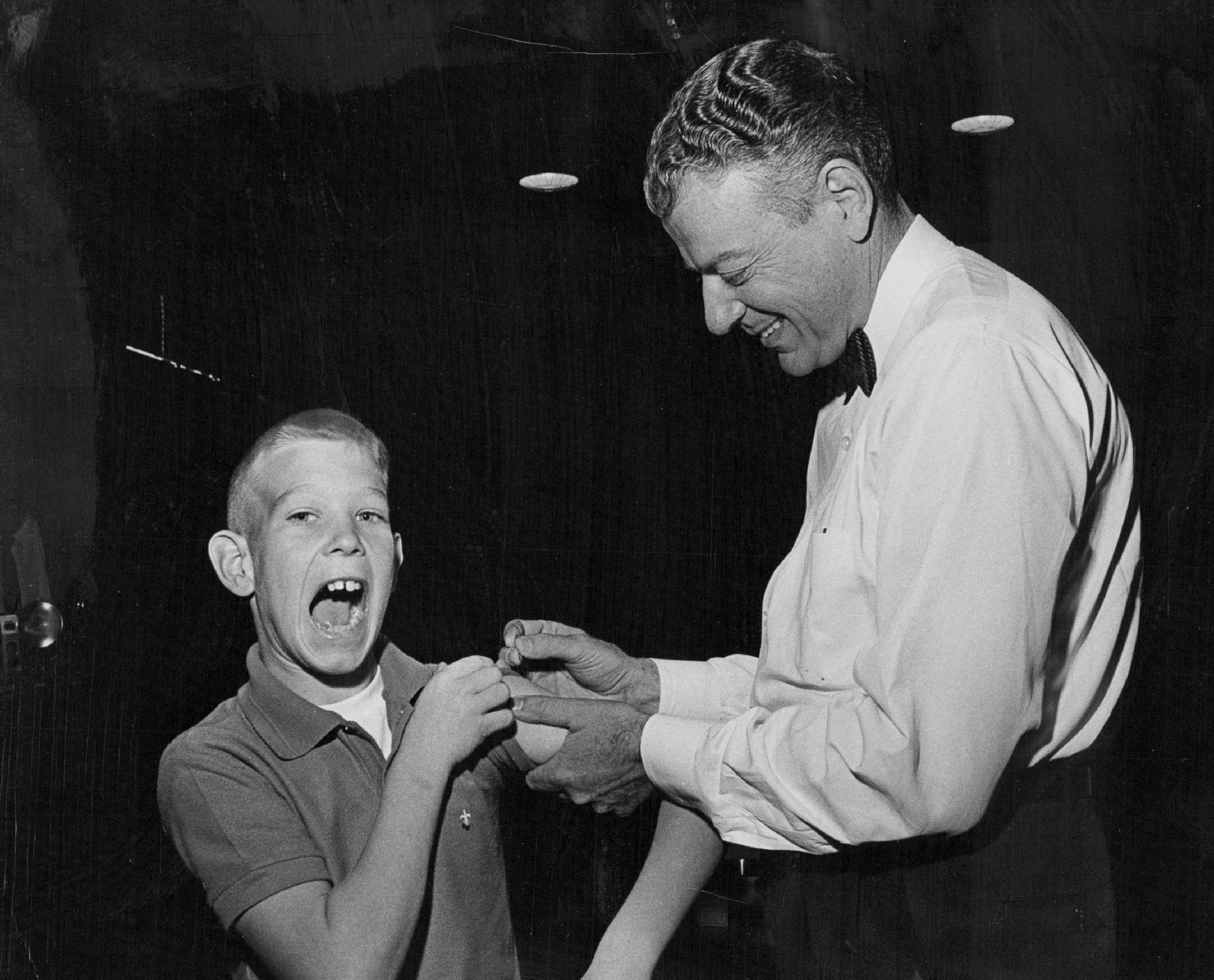 PHOTO: Paul Witzen, 11, of Colorado makes a face while he gets his smallpox vaccination on Nov. 8, 1963.
