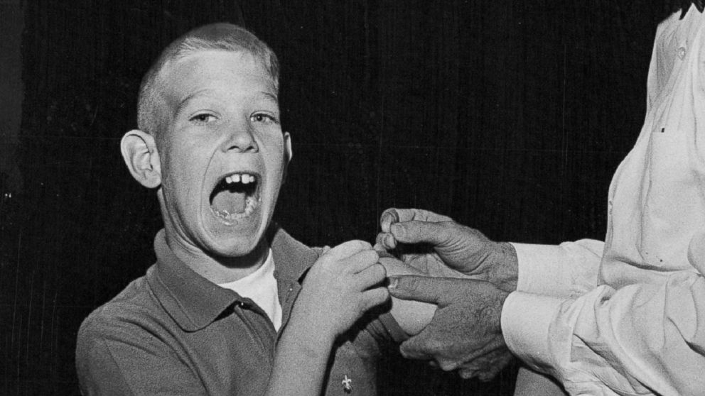PHOTO: Paul Witzen, 11, of Colorado makes a face while he gets his smallpox vaccination on Nov. 8, 1963.
