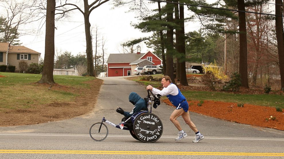 PHOTO: Dick Hoyt pushes Rick Hoyt as they compete in the 2008 Boston Marathon on April 21,2008 in Hopkinton, Massachusetts. 