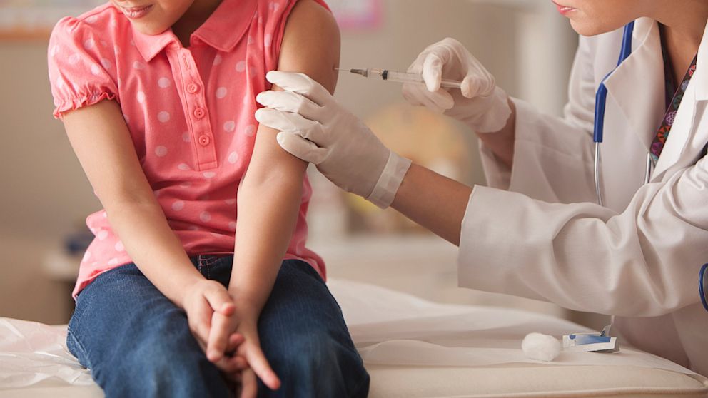 A child patient receives a vaccination.