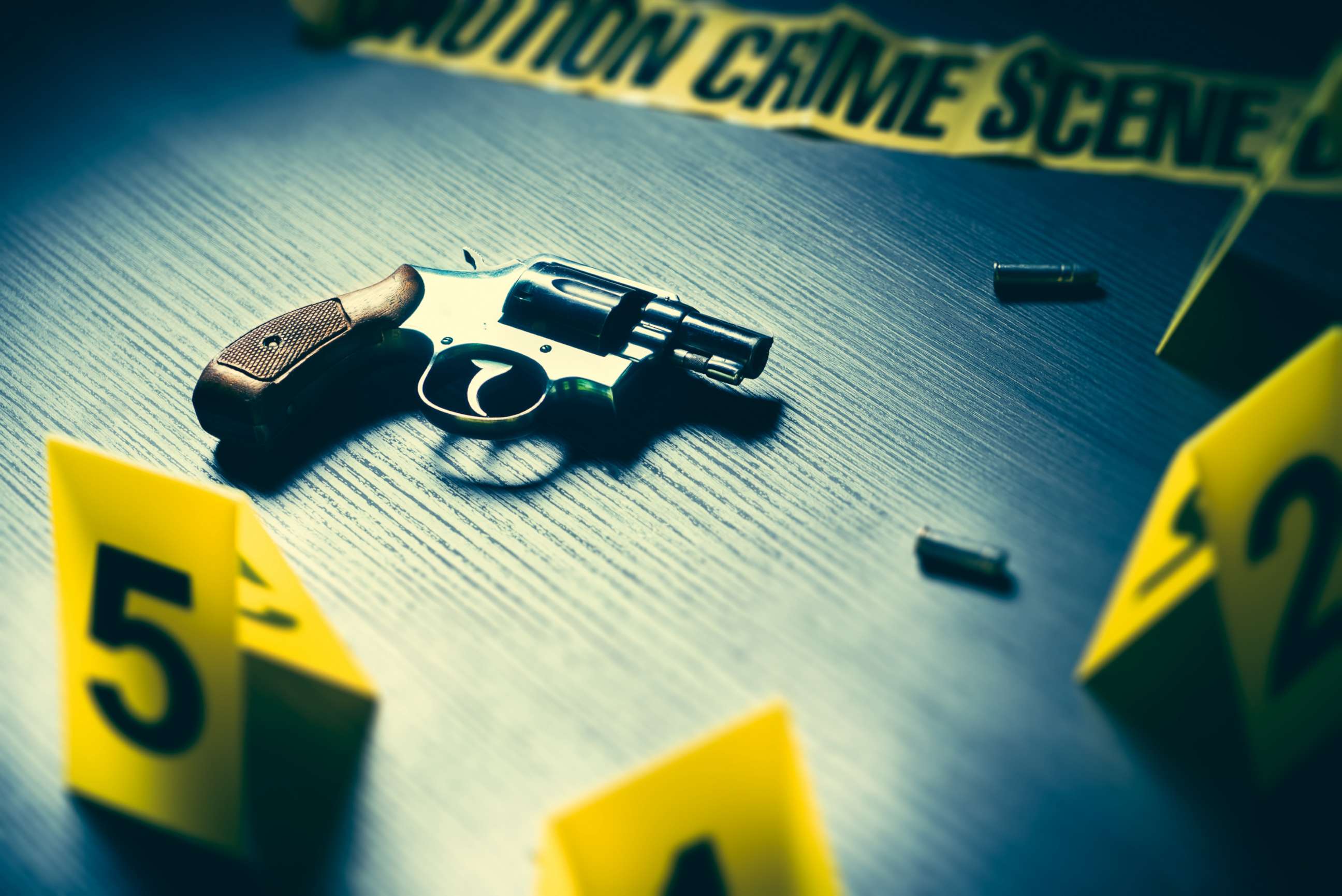 PHOTO: A crime scene with gun and markers on the floor is pictured in this undated stock photo.