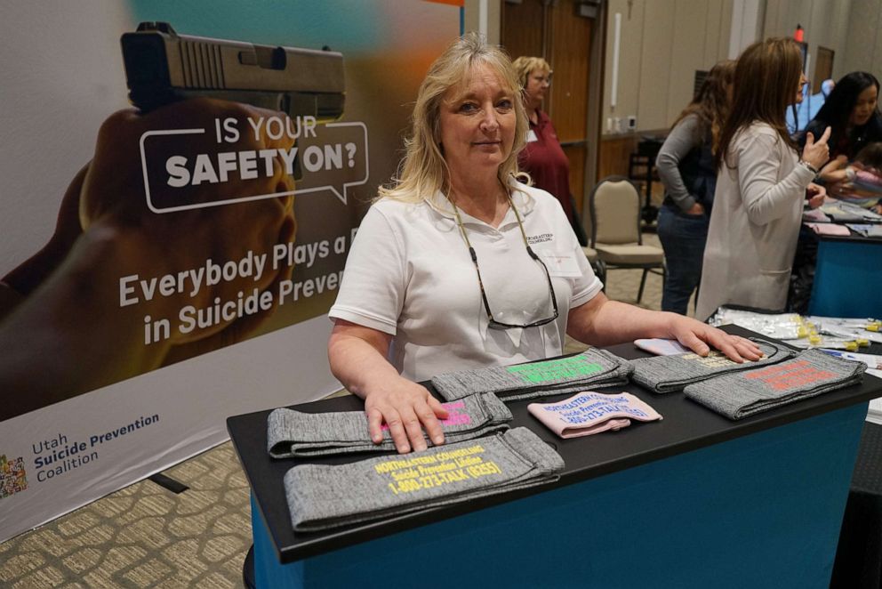 PHOTO: Northeastern Counseling Center prevention specialist Robin Hatch gave out gun socks screen-printed with the National Suicide Prevention Lifeline information at the Vernal Gun & Knife Show in Vernal, Utah.