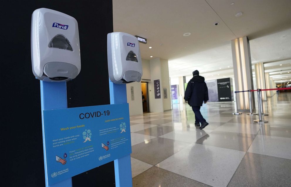 PHOTO: Hand sanitizers hang on the wall with a sign about the novel coronavirus, known officially as COVID-19, at the United Nations headquarters in New York City, U.S., on Feb. 27, 2020.