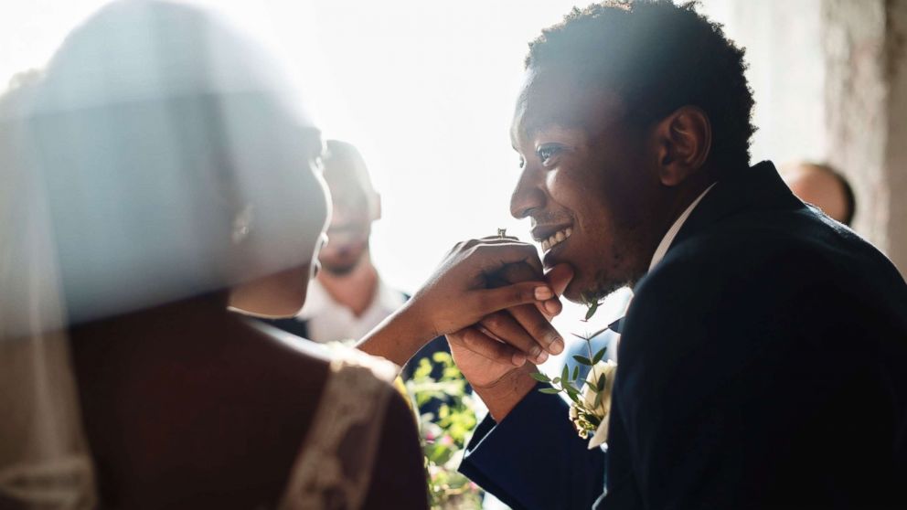 This undated stock photo shows a happy newly wed couple. 