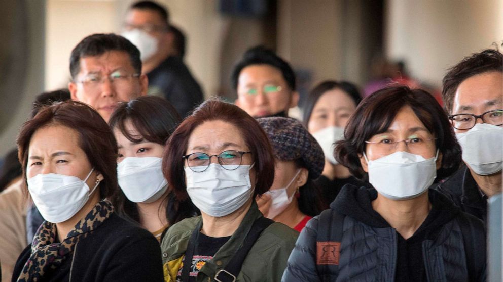 PHOTO: Passengers wear face masks as they arrive on a flight from Asia at Los Angeles International Airport on Jan. 29, 2020.