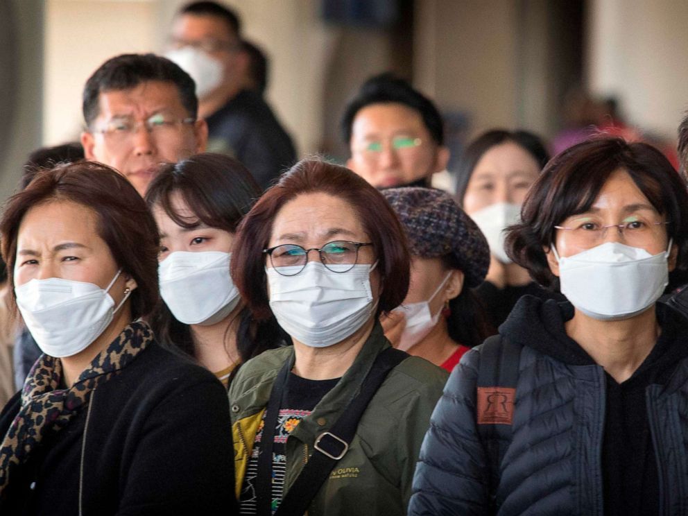 PHOTO: Passengers wear face masks as they arrive on a flight from Asia at Los Angeles International Airport on Jan. 29, 2020.