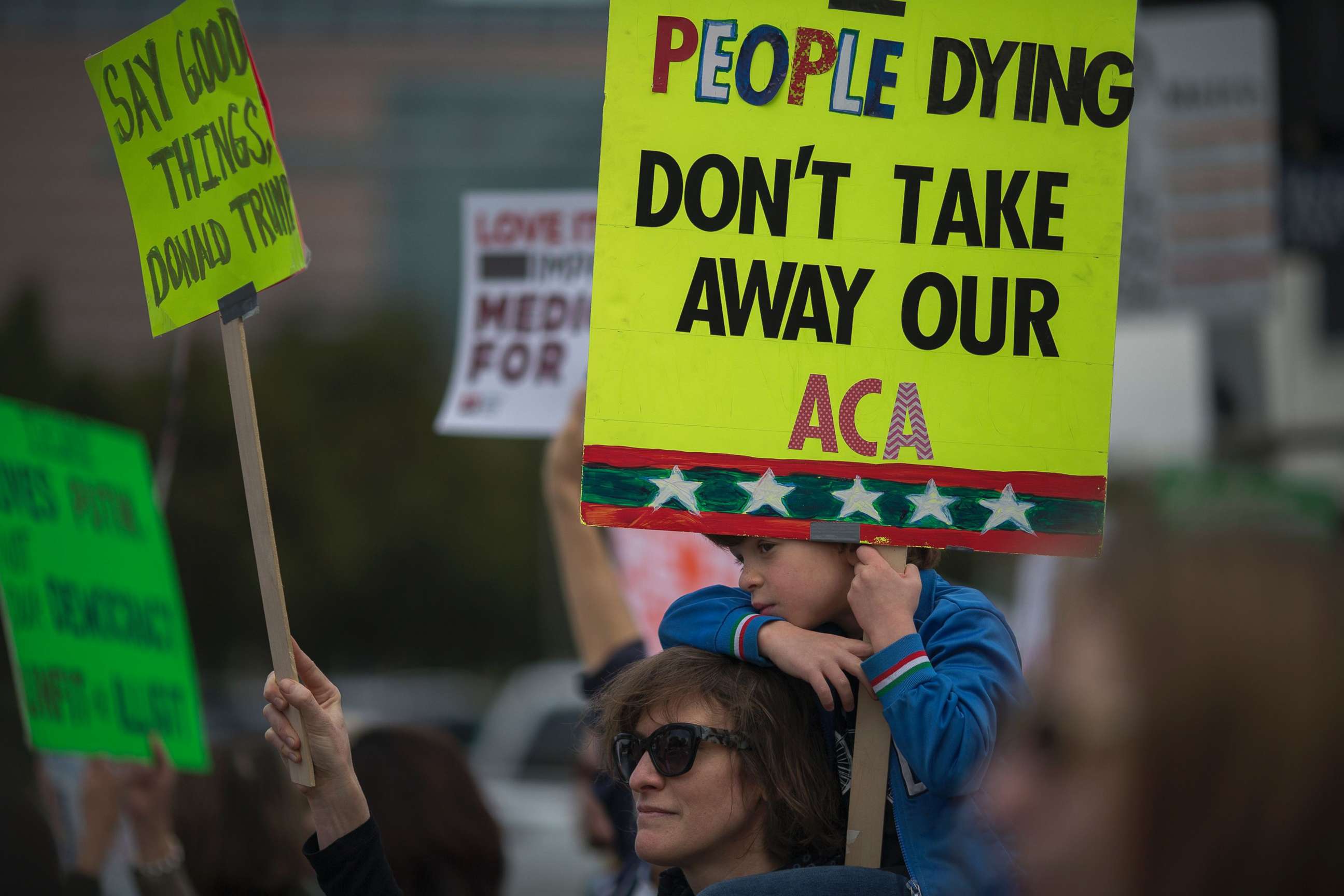 PHOTO: People protest Trump administration policies that threaten the Affordable Care Act, Medicare and Medicaid, near the Wilshire Federal Building, Jan. 25, 2017, in Los Angeles. 