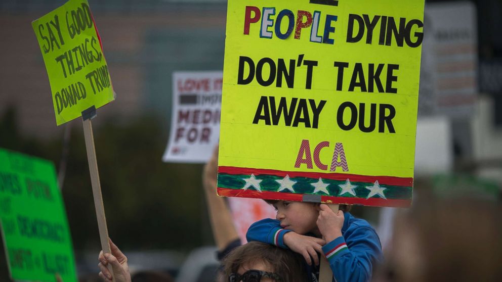 PHOTO: People protest Trump administration policies that threaten the Affordable Care Act, Medicare and Medicaid, near the Wilshire Federal Building, Jan. 25, 2017, in Los Angeles.