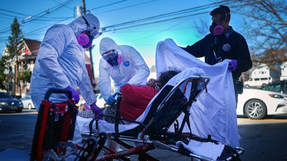 PHOTO: Fire Department emergency medical workers attend to a patient under investigation of having the coronavirus in Paterson, New York, March 24, 2020.