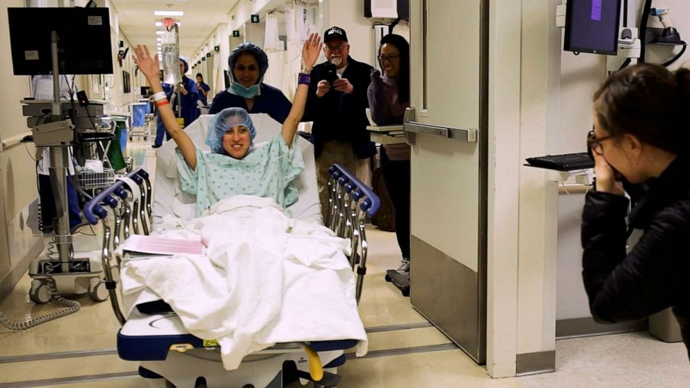 Nina Martinez is wheeled into a Baltimore operating room to become the first living organ donor with HIV, March 25, 2019. Martinez, 35, donated a kidney to an HIV-positive stranger, saying she "wanted to make a difference in somebody else's life" and counter the stigma that too often still surrounds HIV infection.
