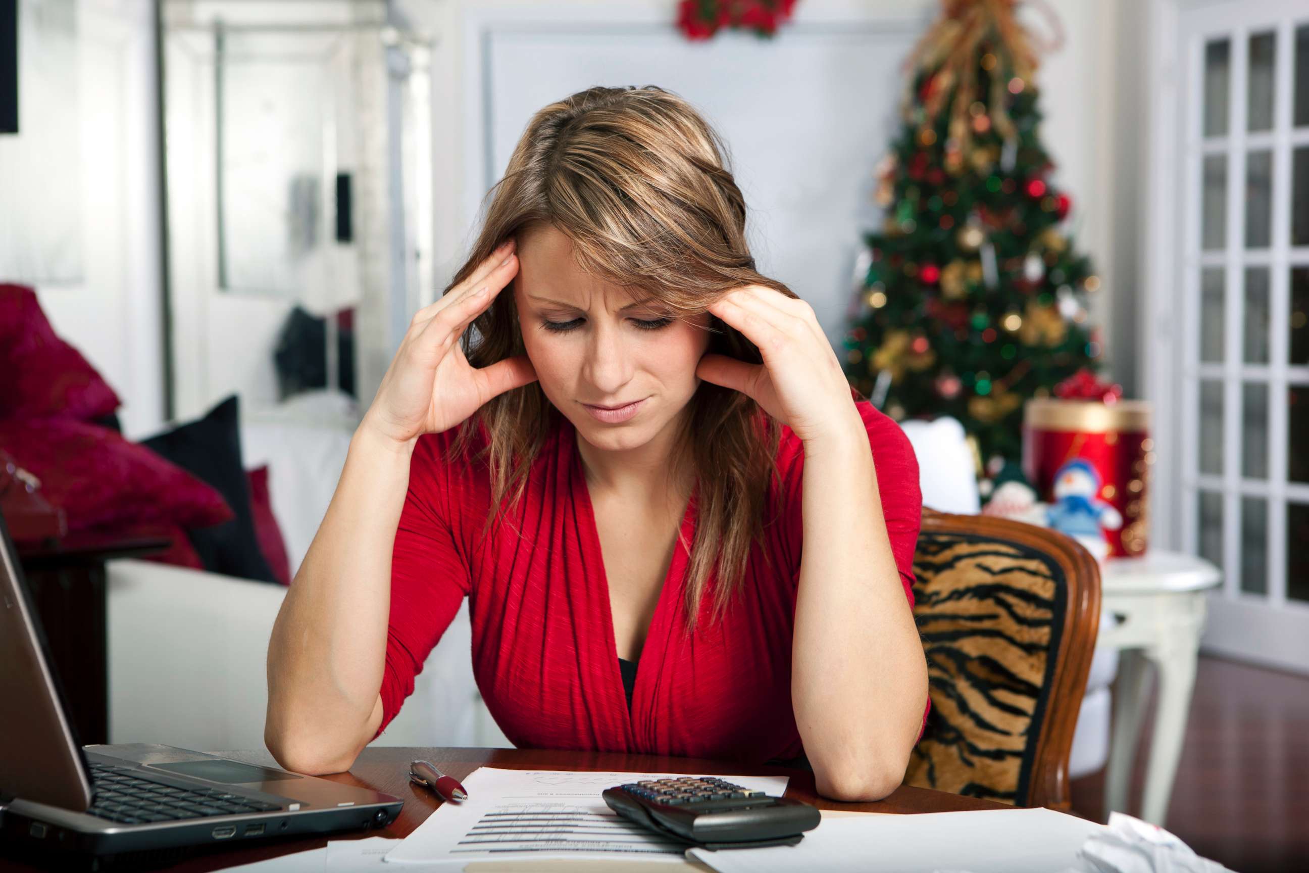 PHOTO: This stock photo depicts a woman who is stressed during the holiday season.