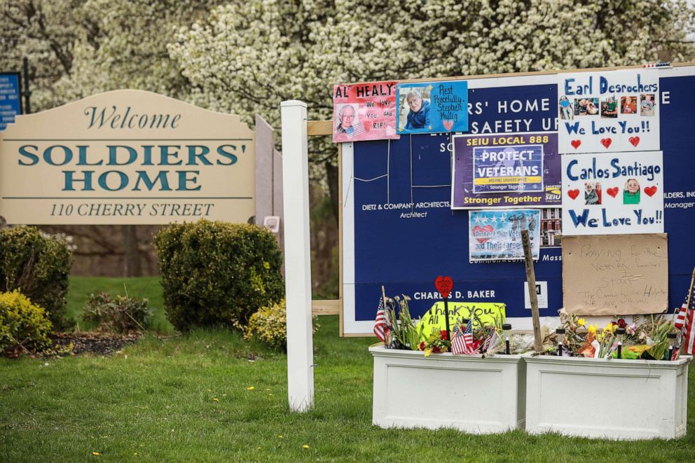 PHOTO: In this April 29, 2020, file photo, remembrances and signs of support are posted outside the Holyoke Soldiers' Home in Holyoke, Mass.