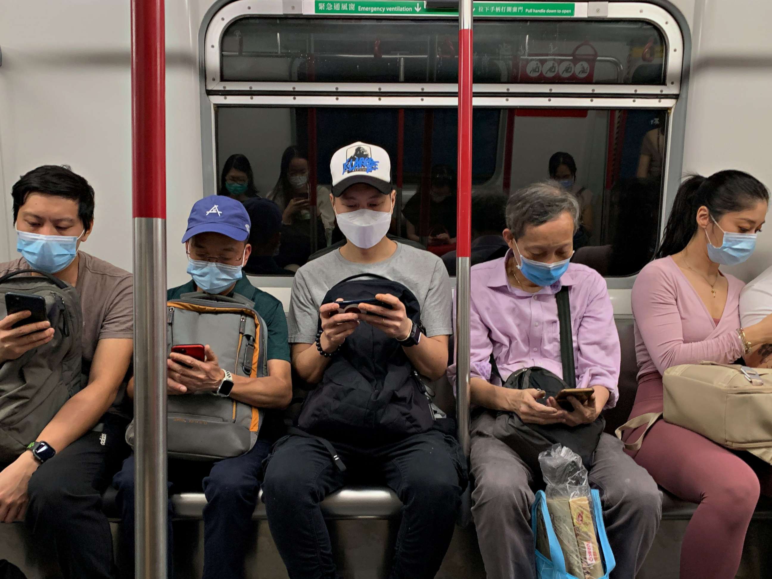 PHOTO: Passengers wear surgical masks in an MTR train in Hong Kong, July 13, 2020.