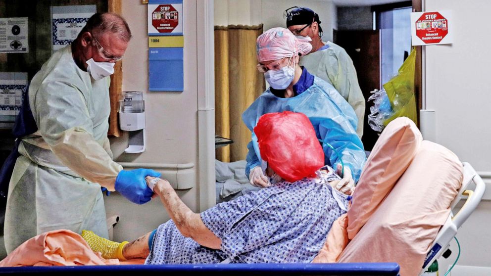 PHOTO: Members of a COVID medical team transport a COVID-19 positive patient to their room at Sarasota Memorial Hospital in Sarasota, Fla., Sept. 21, 2021.