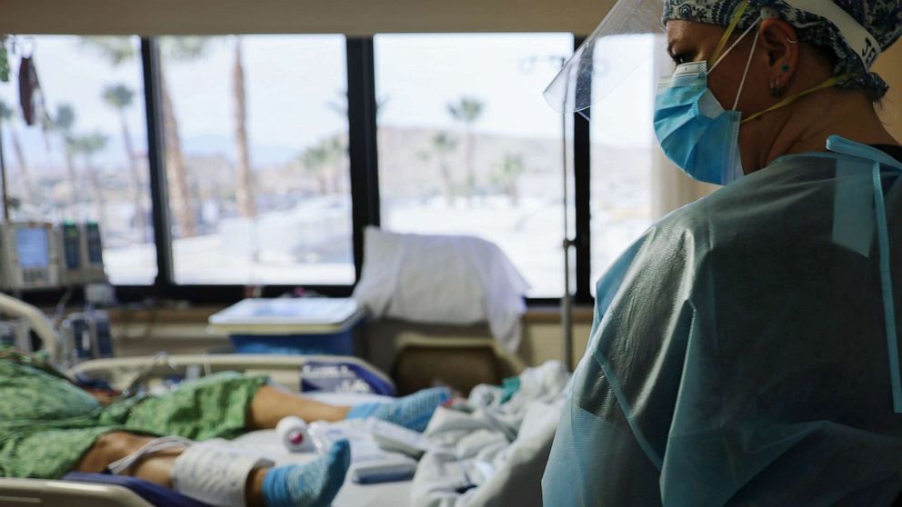 PHOTO: A clinician cares for a COVID-19 patient in the Intensive Care Unit (ICU) at Providence St. Mary Medical Center, Dec. 23, 2020, in Apple Valley, Calif.