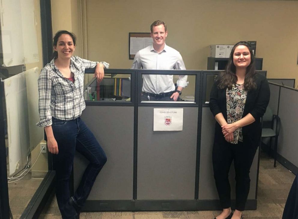 PHOTO: Part of leadership from Loyola University’s medical students who helped staff the hospital’s hotline stand on-call in the center: Left to right: Giselle Elisabeth Karine Malina, Herbert Parker Strider and Eda Akyar. 