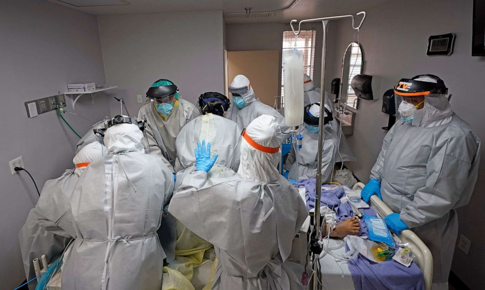 PHOTO: Dr. Joseph Varon, right, leads a team as they try to save the life of a patient unsuccessfully inside the Coronavirus Unit at United Memorial Medical Center, Monday, July 6, 2020, in Houston.