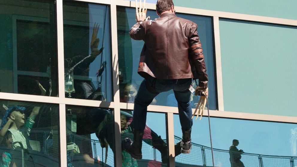 PHOTO: A man dressed as Wolverine from "The X-Men" rappels from the roof of the Dell Children's Medical Center in Austin, Texas as part of Superhero Day on April 30, 2015.
