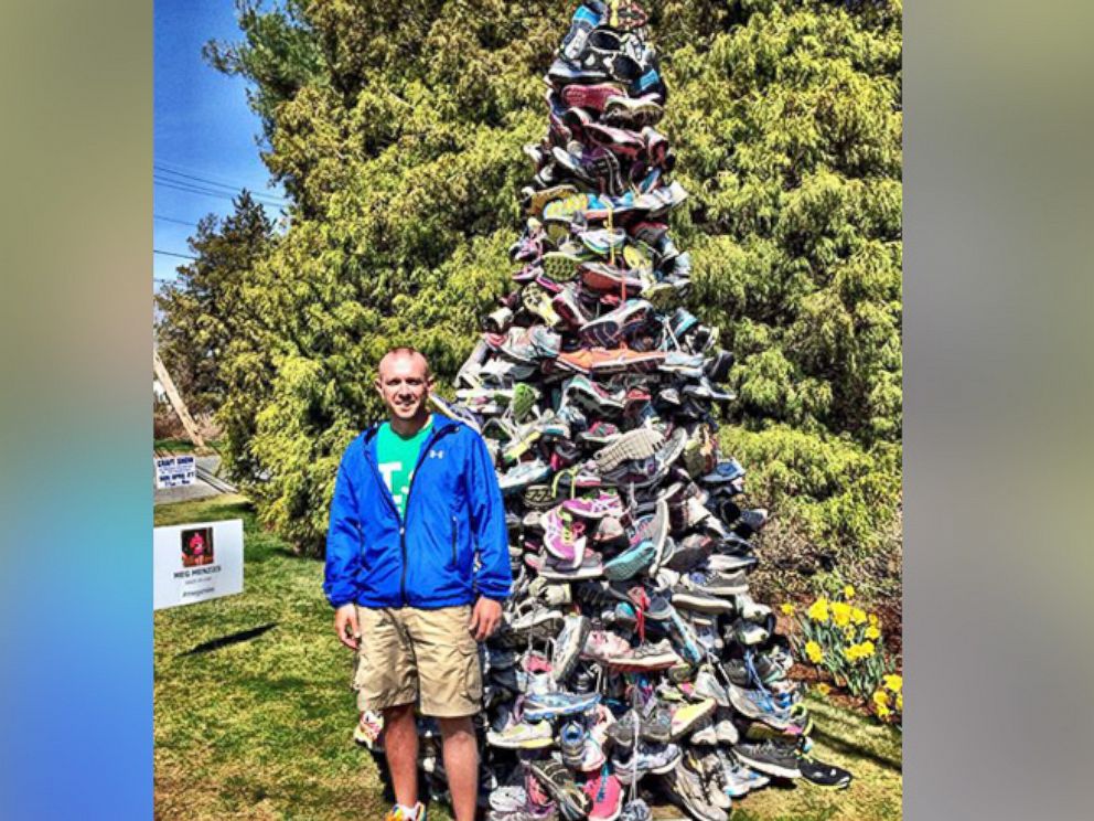PHOTO: Scott Menzies stands next to the "Meg Soles of Love" memorial for his wife in Hopkinton, Mass.