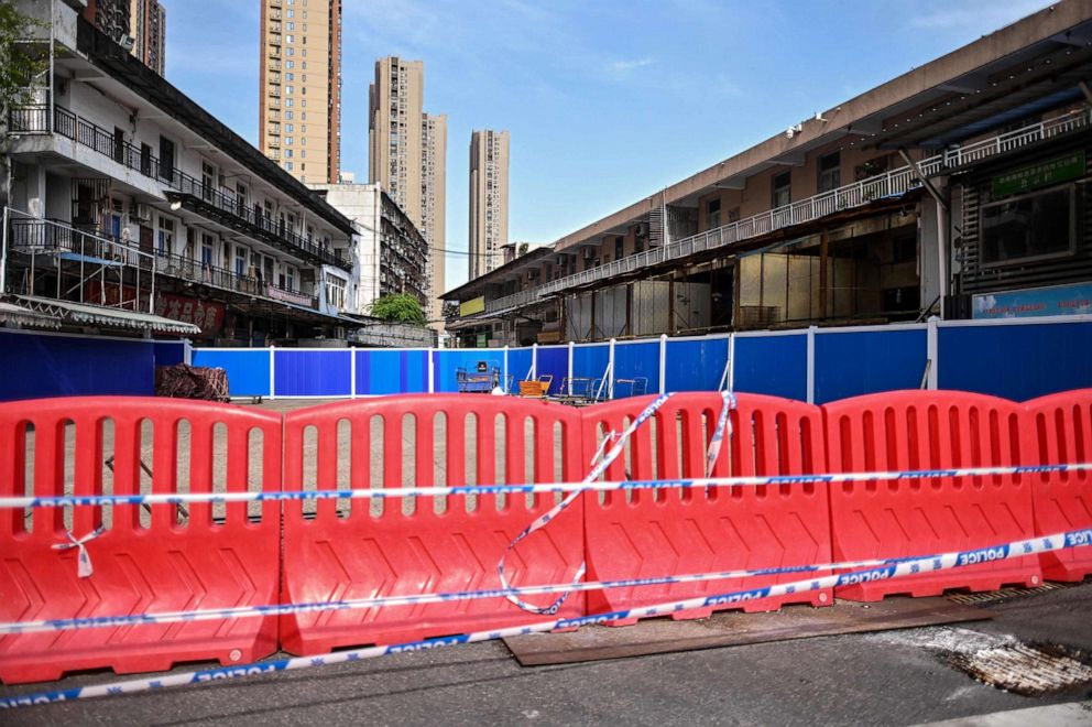 PHOTO: Barriers are setup at the closed Huanan Seafood Market where the COVID-19 coronavirus is believed to have emerged in Wuhan, China, April 15, 2020.