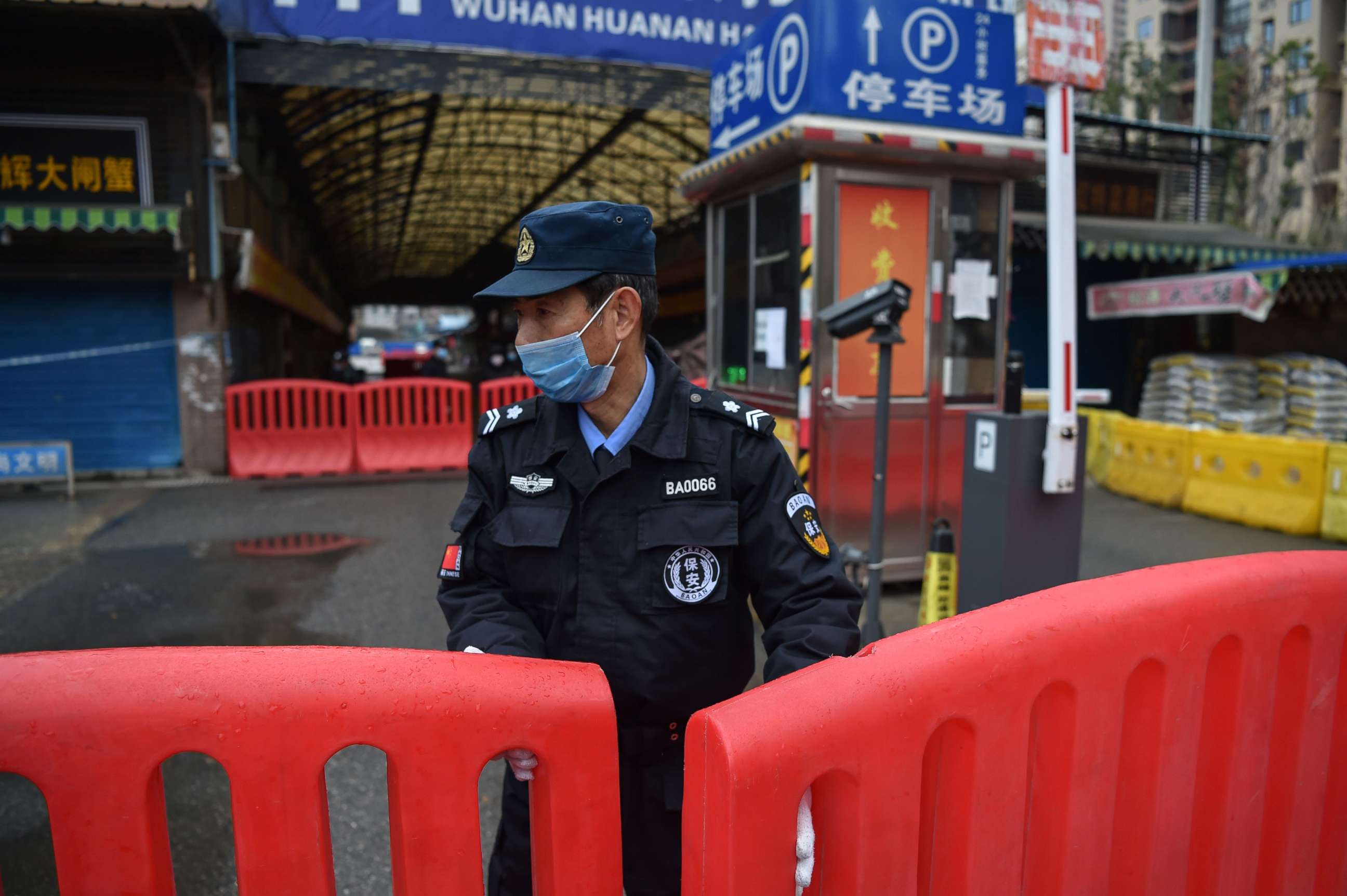 PHOTO: A police officer stands guard outside of Huanan Seafood Wholesale market in Wuhan on Jan. 24, 2020.