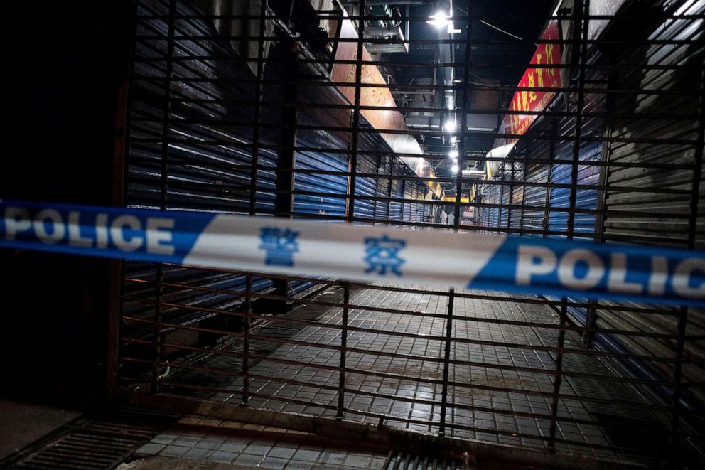 PHOTO: FILE - Members of staff of the Wuhan Hygiene Emergency Response Team conduct searches on the closed Huanan Seafood Wholesale Market in the city of Wuhan, in the Hubei Province, Jan. 11, 2020.