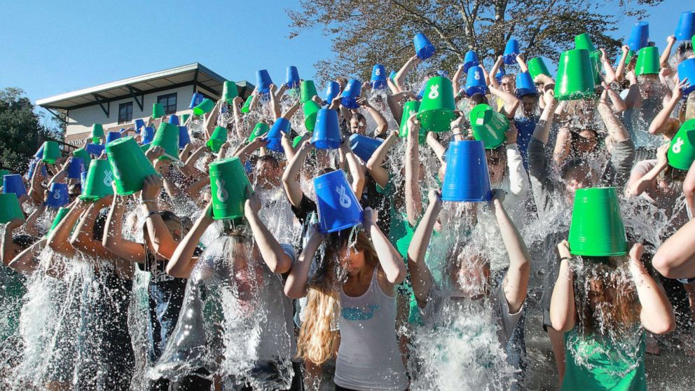 PHOTO: Students and others attempt to break the world record for number participants in an Ice Bucket Challenge during events celebrating the dedication of Peter Frates Hall at Endicott College in Beverly, Mass., Sept. 13, 2016.