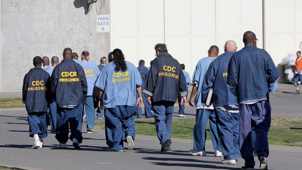 PHOTO: Inmates walk through the exercise yard at California State Prison Sacramento, near Folsom, Calif., Feb. 26, 2013.