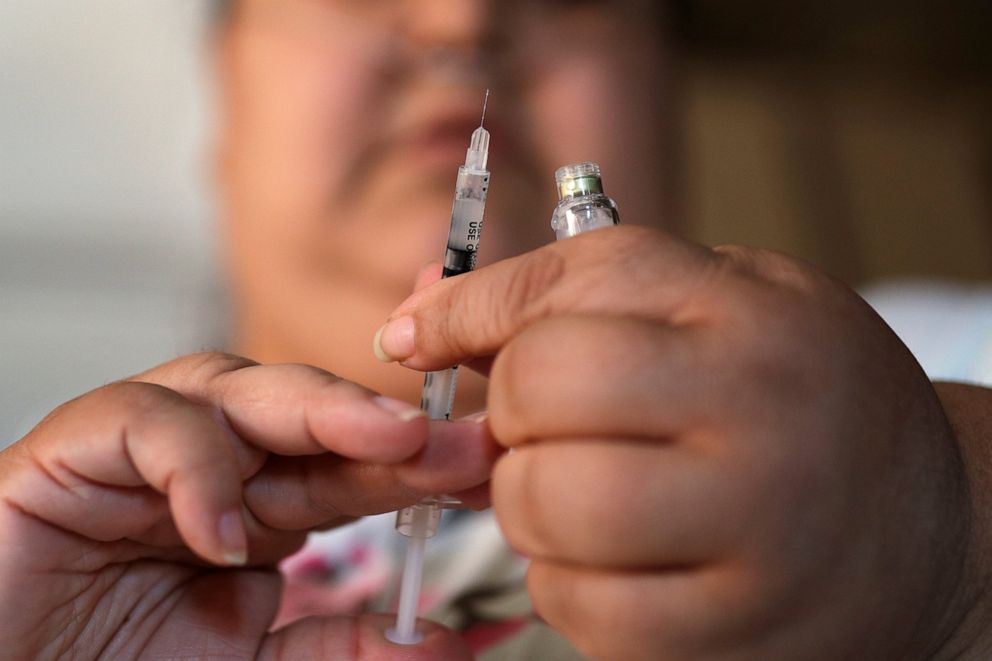 PHOTO: In this April 18, 2017 file photo, a woman with diabetes prepares to inject herself with insulin.