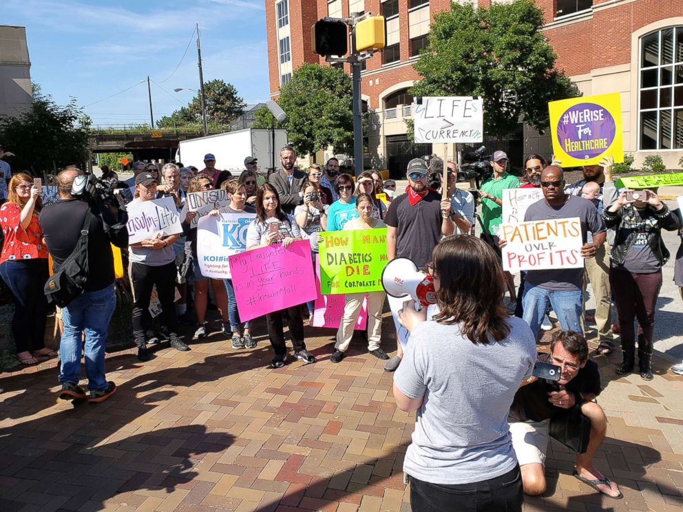 PHOTO: Elizabeth Pfiester, founder of T1International, addresses a crowd outside the Indianapolis headquarters of pharmaceutical giant Eli Lilly and Co. in September.