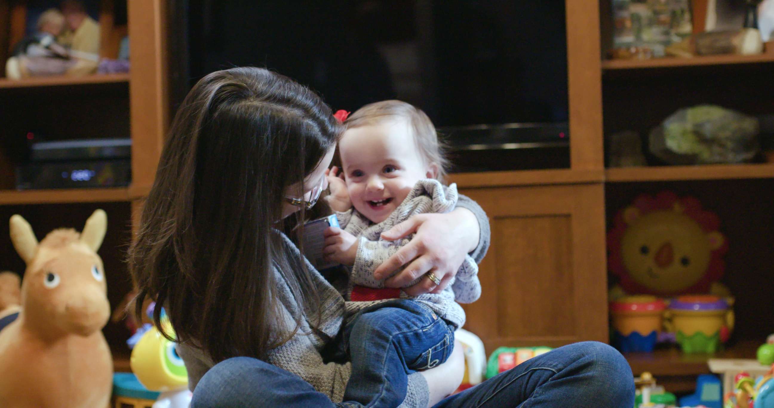 PHOTO: Irie, now over a year old, grins as she plays with her mother, Crissa Felkner.