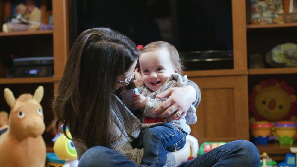 PHOTO: Irie, now over a year old, grins as she plays with her mother, Crissa Felkner.