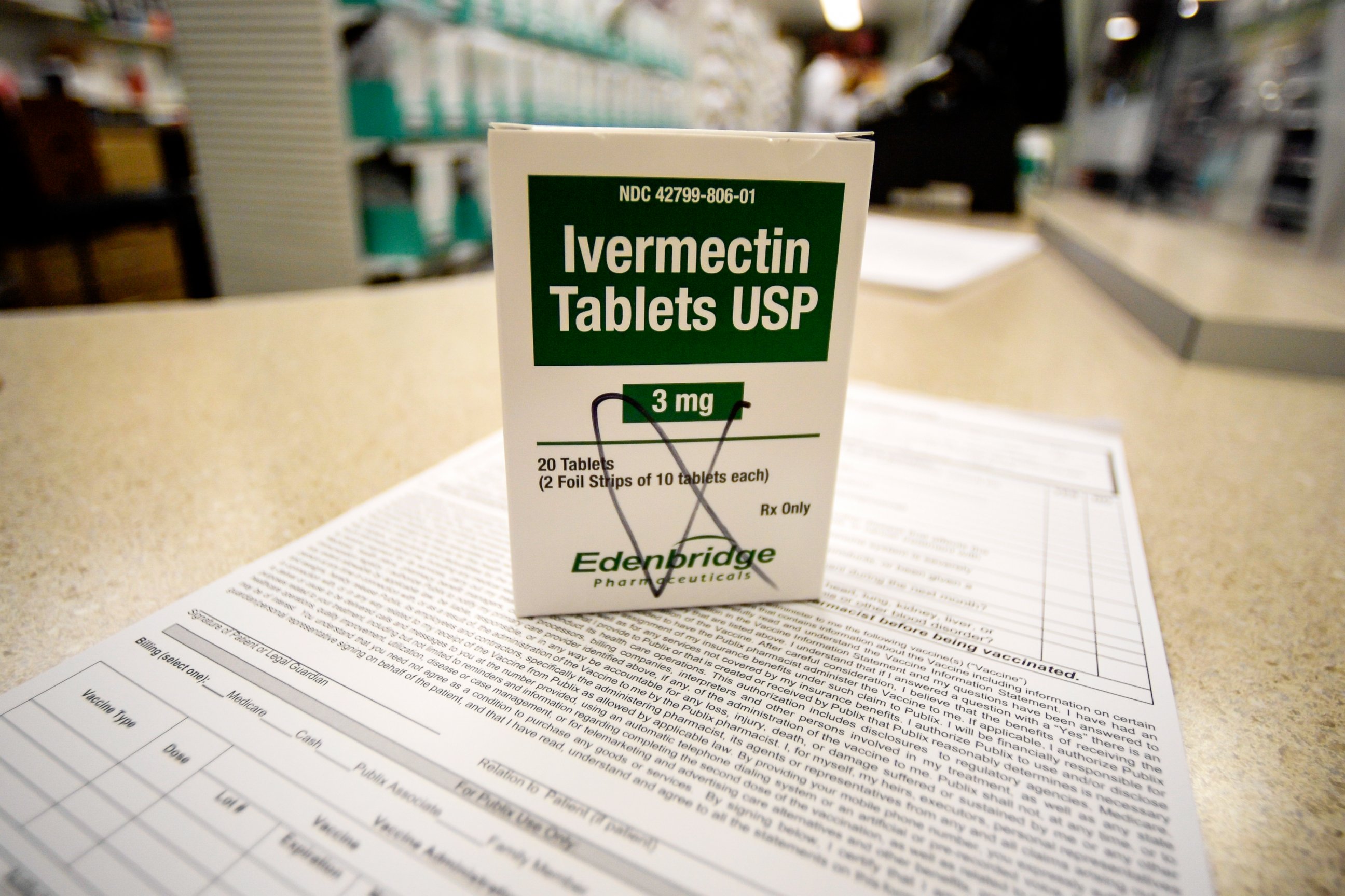 PHOTO: A box of ivermectin is shown in a pharmacy as pharmacists work in the background, Thursday, Sept. 9, 2021, in Georgia. 