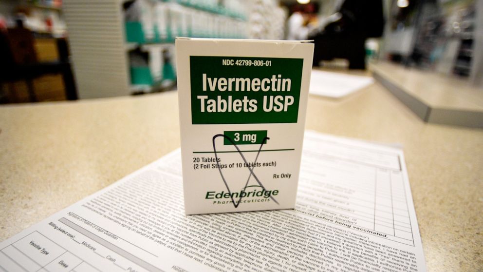PHOTO: A box of ivermectin is shown in a pharmacy as pharmacists work in the background, Thursday, Sept. 9, 2021, in Georgia. 