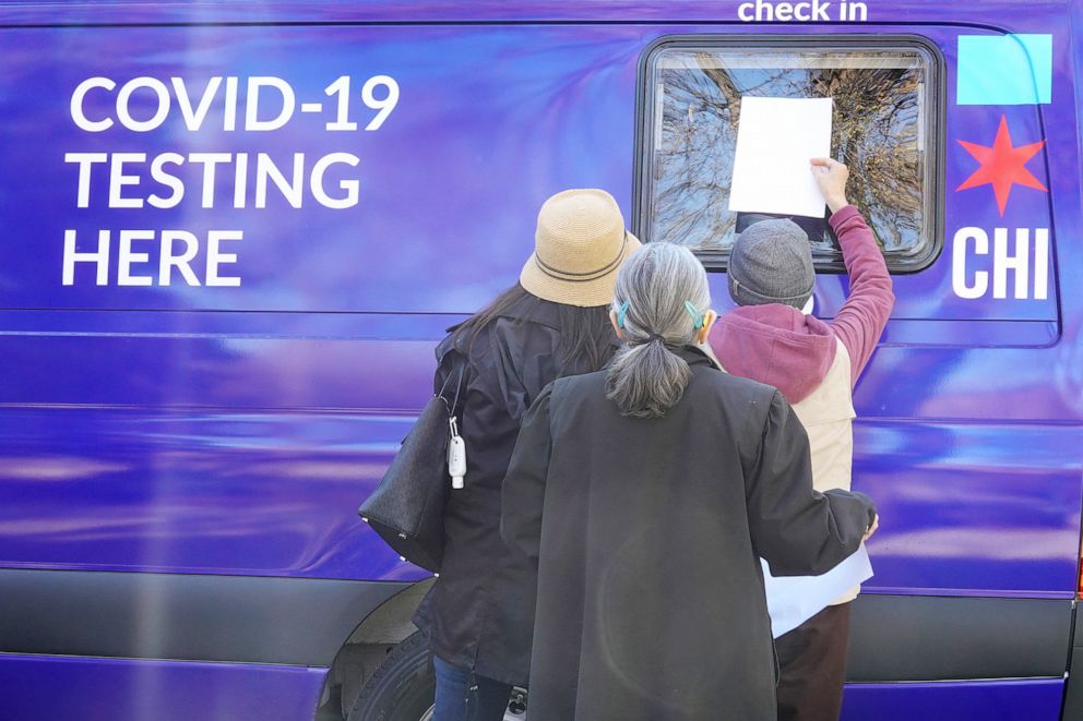 PHOTO: Residents check in for a COVID-19 test at a test site in Chicago, Nov. 12, 2020.