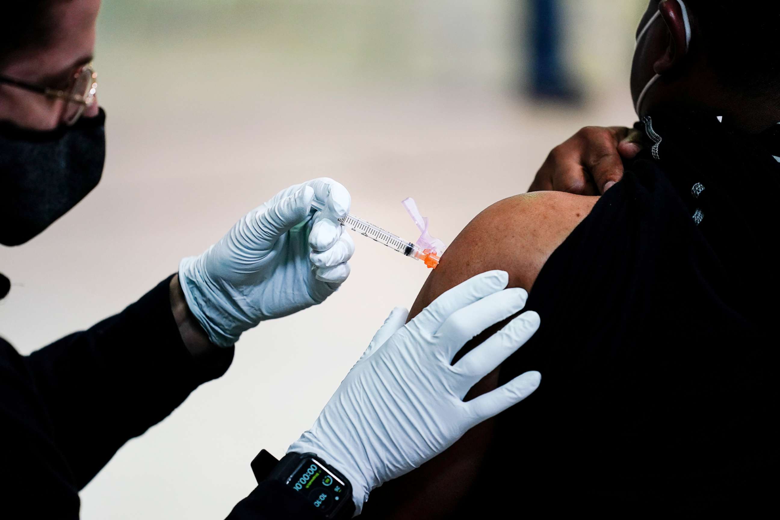 PHOTO: In this March 26, 2021, file photo, a member of the Philadelphia Fire Department administers the Johnson & Johnson COVID-19 vaccine to a person at a vaccination site at a Salvation Army location in Philadelphia.