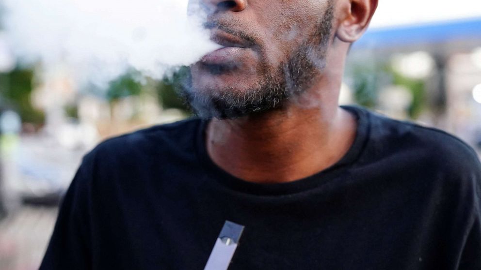 PHOTO: A man uses a Juul vaporizer in Atlanta, Sept. 26, 2019.