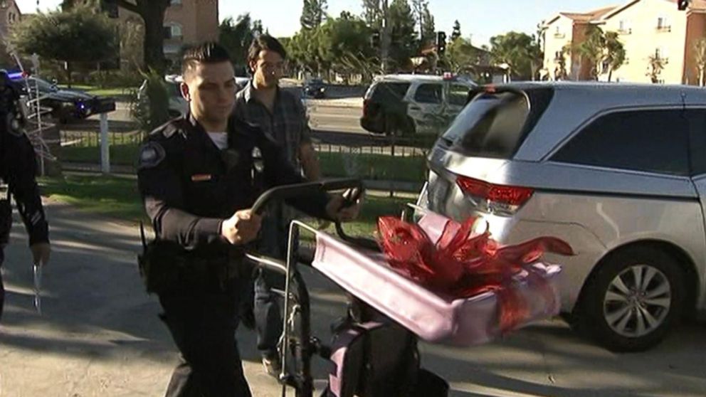 PHOTO: A police officer delivers the new wheelchair.