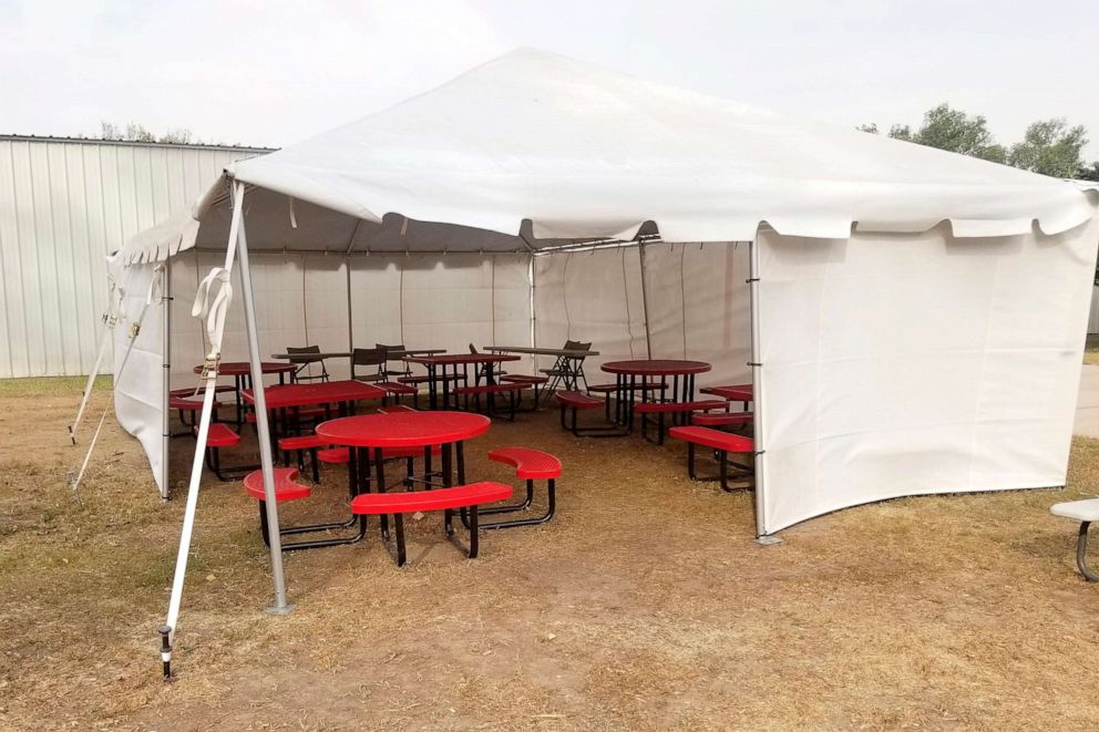 PHOTO: A tent used as a lunchroom at the Quinter Junior-Senior High School in Quinter, Kan., sits on the school grounds, Oct. 14, 2020, as part of the local school district's efforts to combat COVID-19.