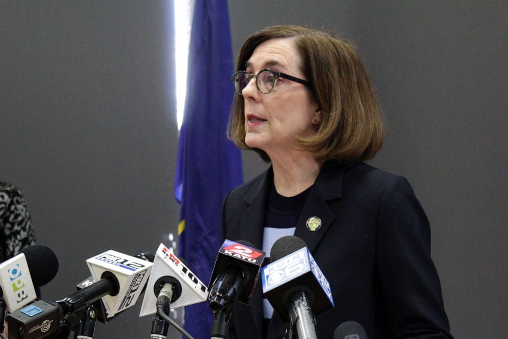 PHOTO: In this March 16, 2020 file photo, Gov. Kate Brown speaks at a news conference to announce a four-week ban on eat-in dining at bars and restaurants throughout the state in Portland, Ore., to slow the spread of the new coronavirus.
