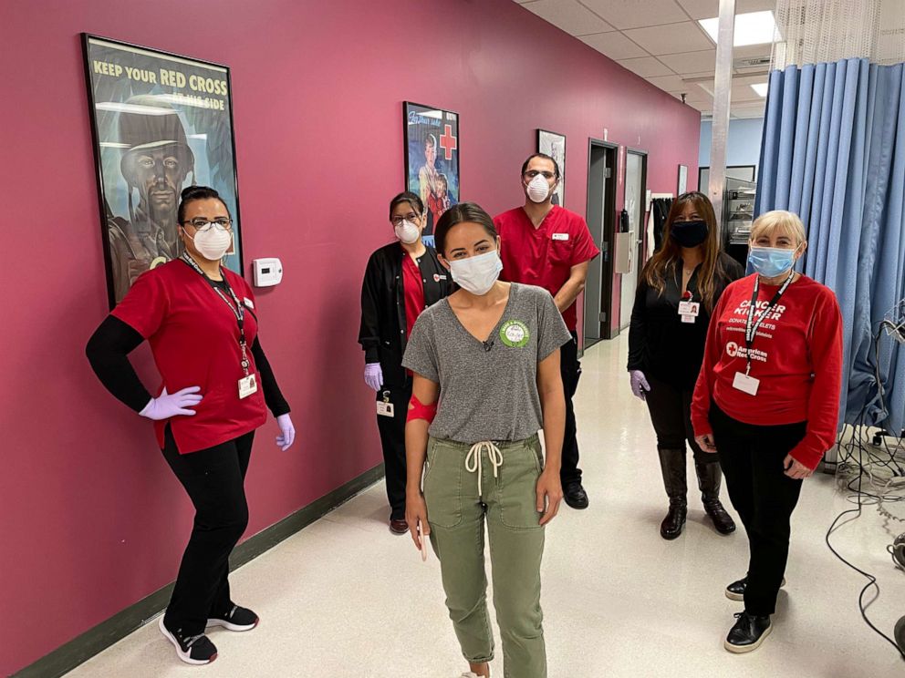 PHOTO: ABC News correspondent Kaylee Hartung poses with Red Cross staffers after donating convalescent plasma in the fight against COVID-19 in Los Angeles, April 22, 2020.