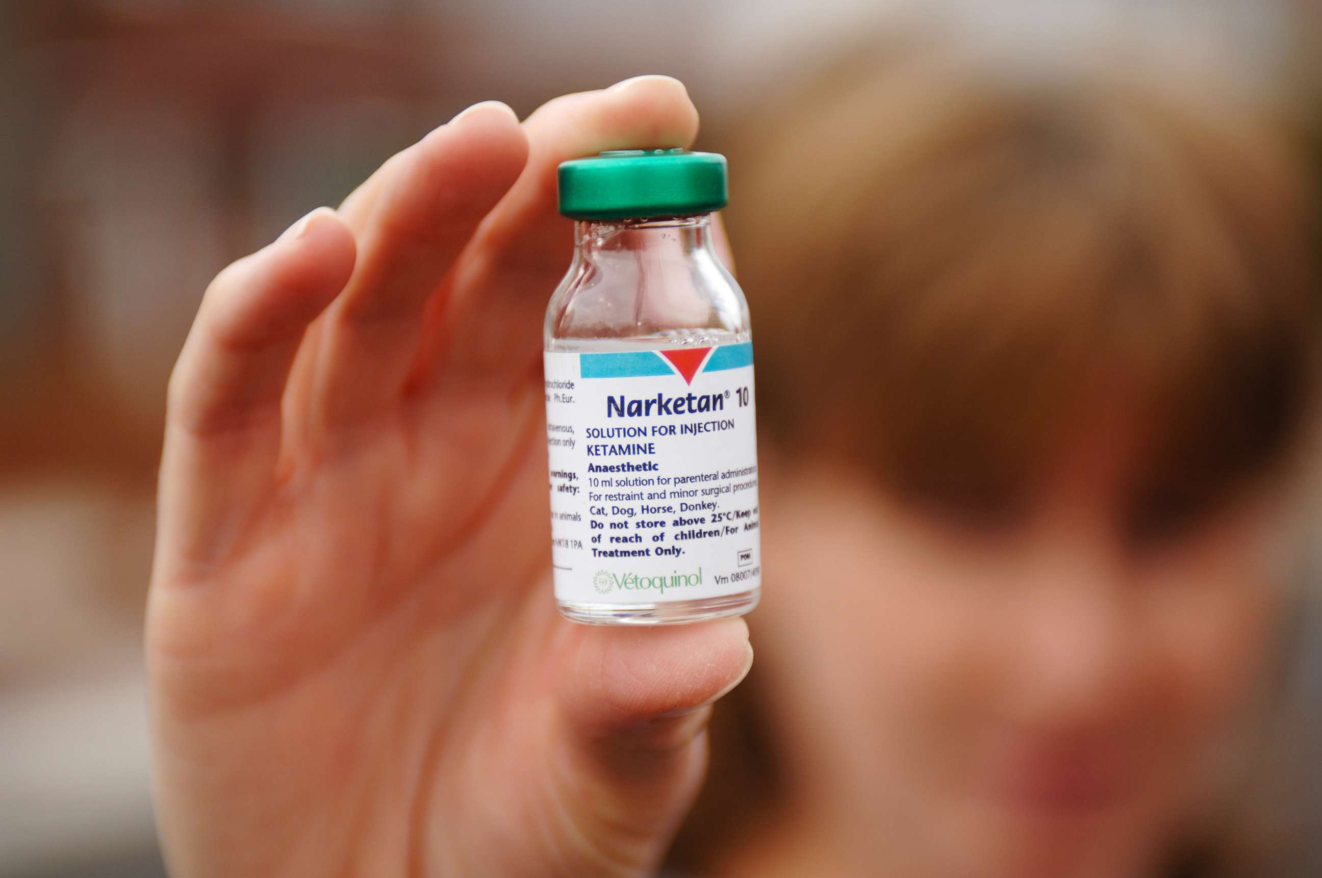 PHOTO: A person holding up a bottle of Ketamine.