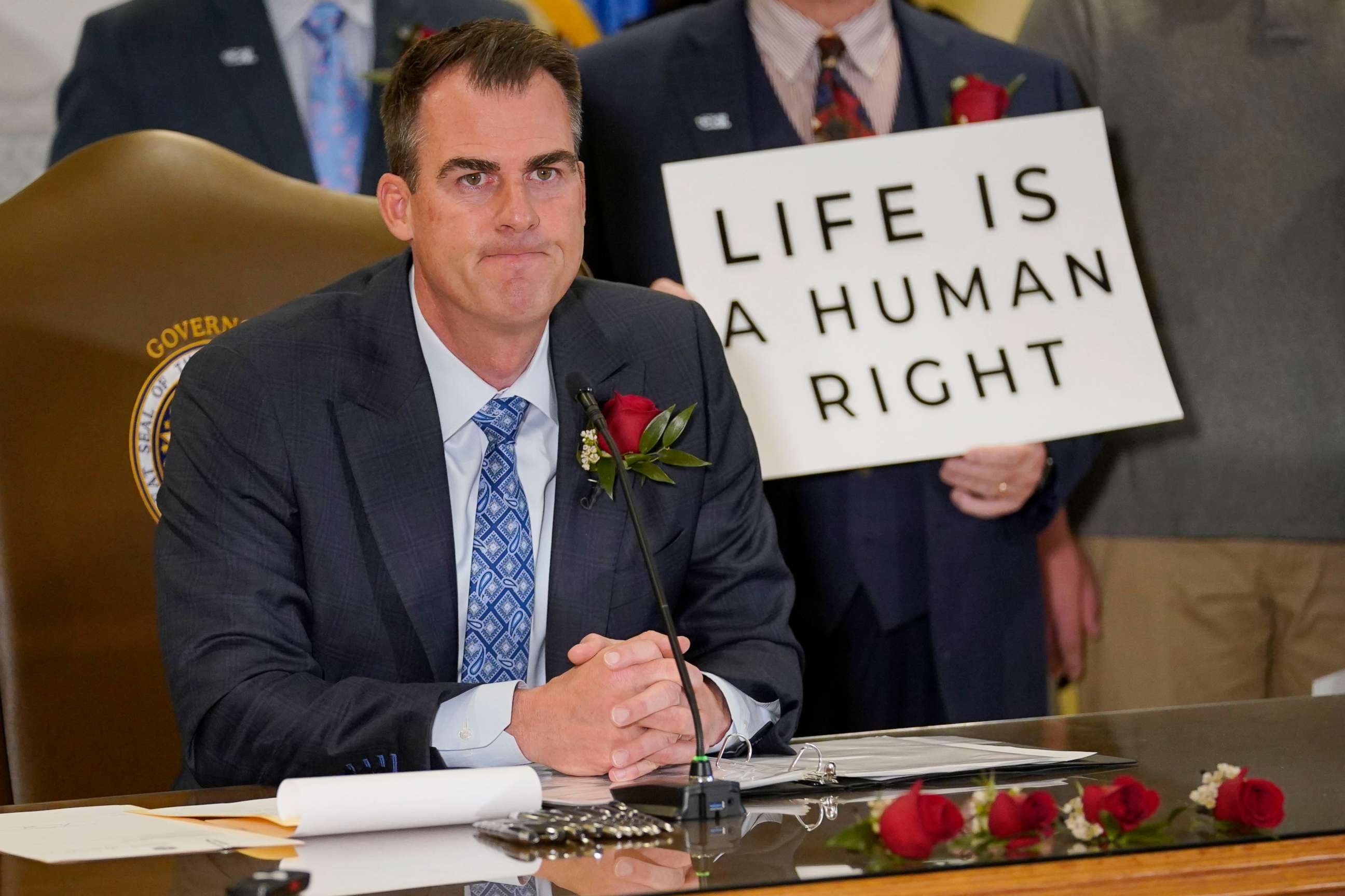 PHOTO: Oklahoma Gov. Kevin Stitt speaks after signing into law a bill making it a felony to perform an abortion, punishable by up to 10 years in prison, April 12, 2022, in Oklahoma City.