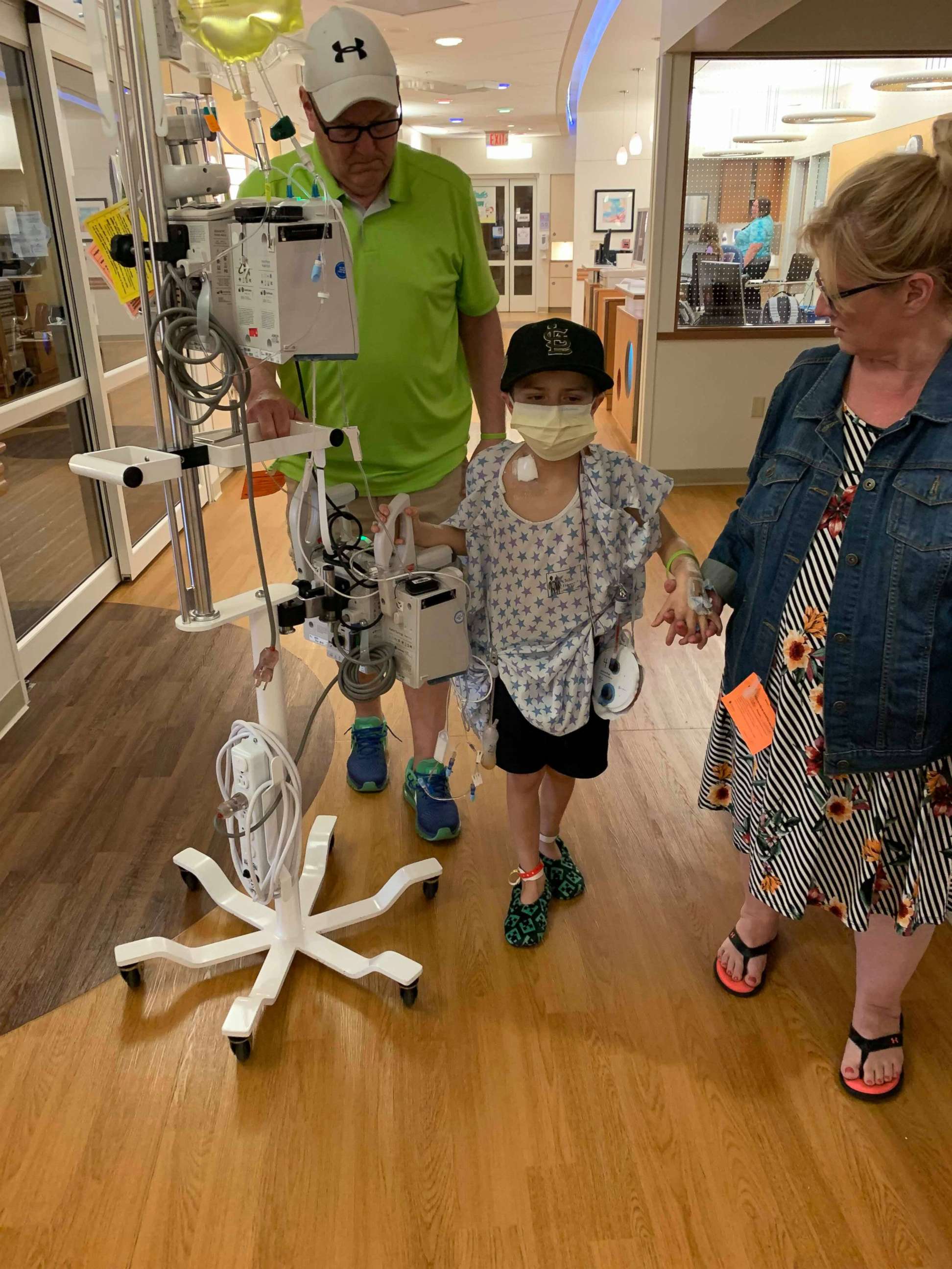 PHOTO: Brayden Auten walks with a family member around the hospital. He recieved his liver transplant from a nurse named Cami Loritz who heard of his story.