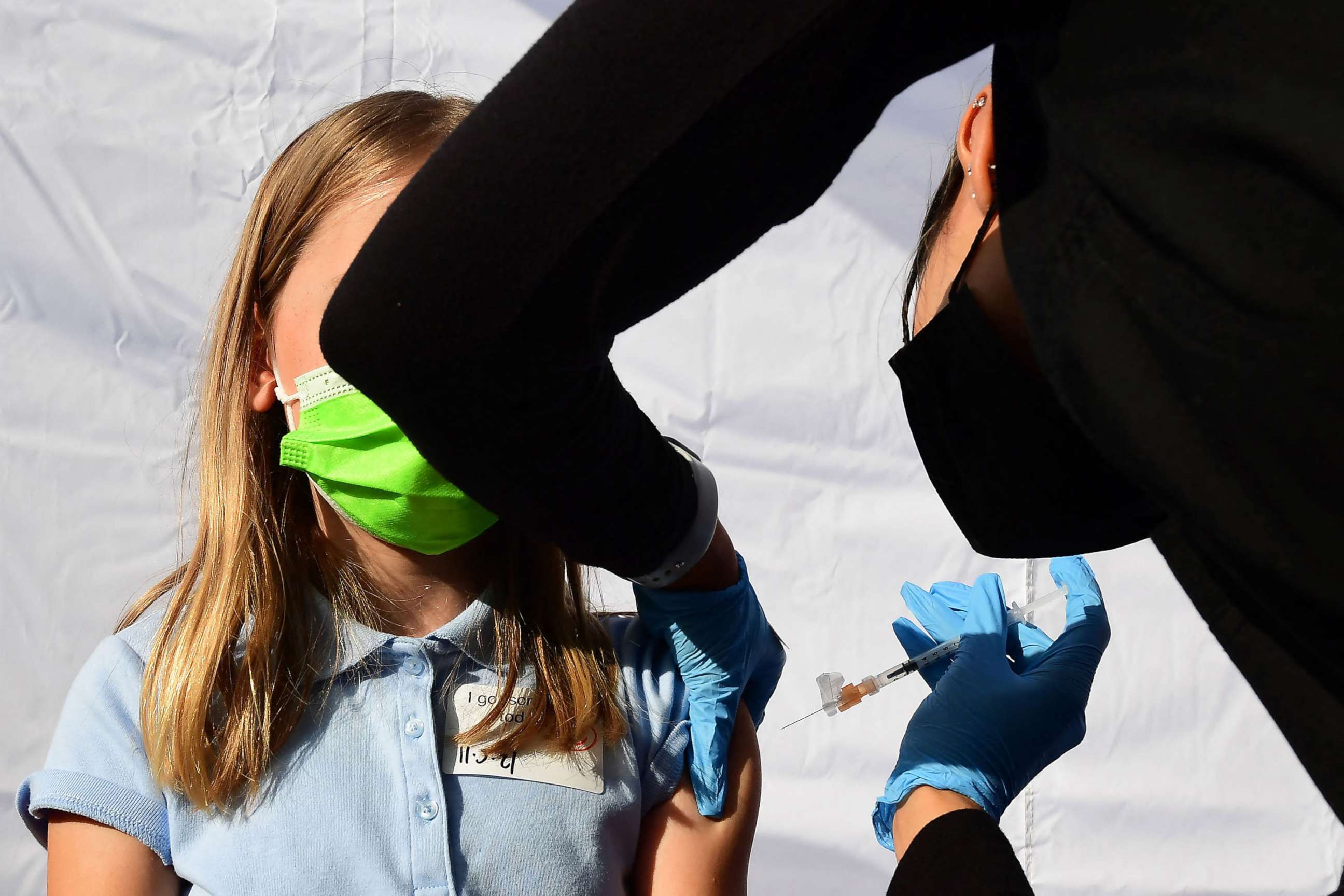 PHOTO: A child receives a dose of Pfizer's Covid-19 vaccine at an event launching school vaccinations in Los Angeles, Nov. 5, 2021.