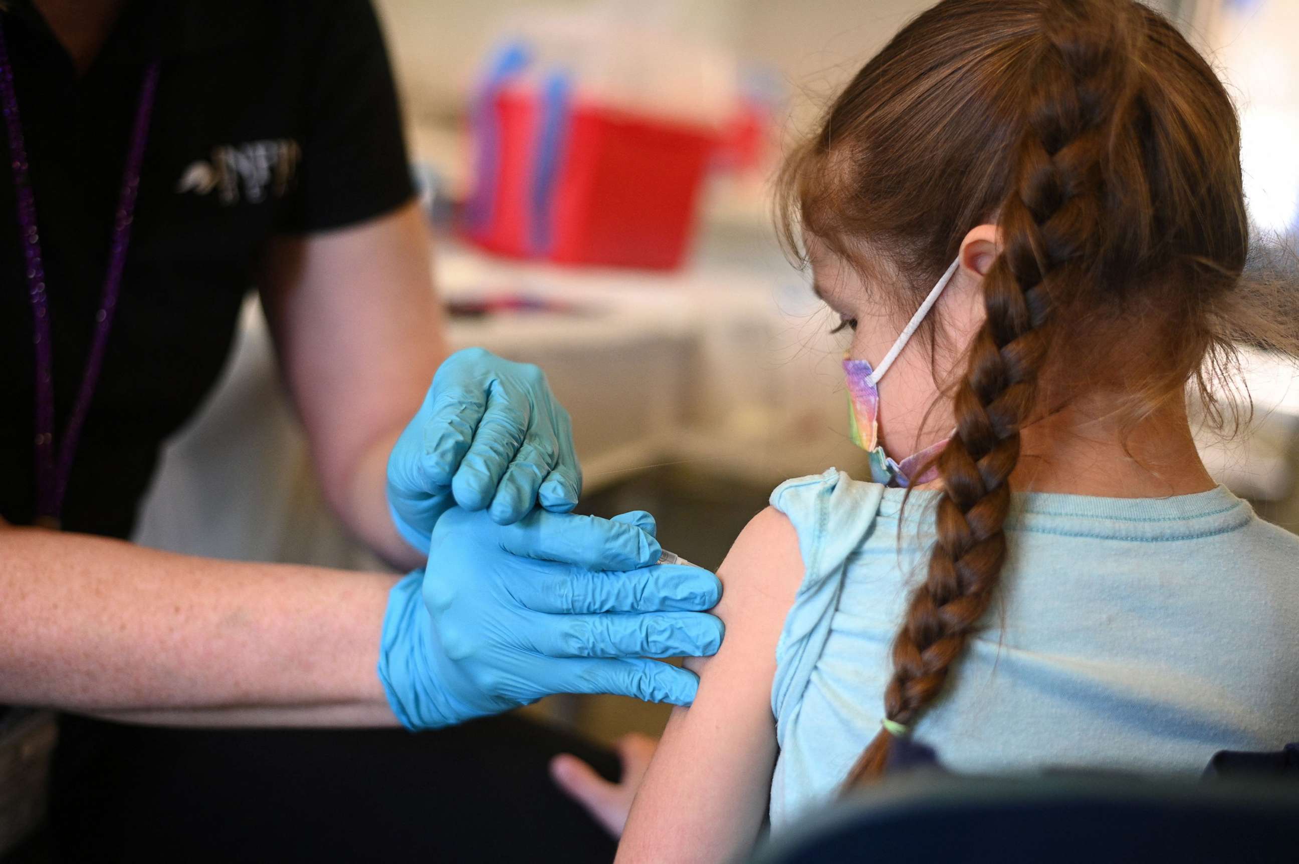 PHOTO: A nurse administers a pediatric dose of the Covid-19 vaccine to a girl at a L.A. Care Health Plan vaccination clinic at Los Angeles Mission College in the Sylmar neighborhood in Los Angeles, Jan. 19, 2022.