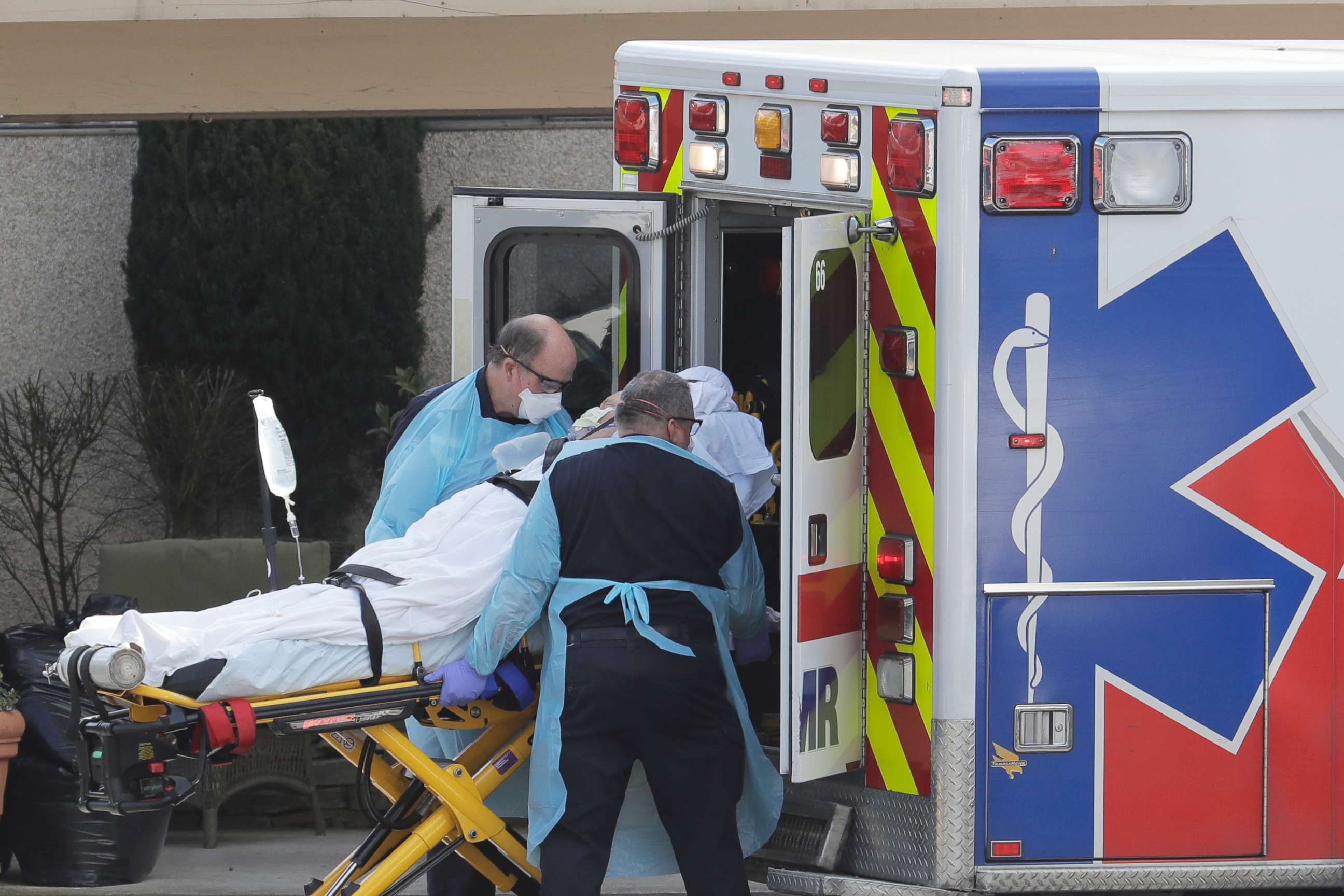 PHOTO: A person is loaded into an ambulance, Thursday, March 12, 2020, at the Life Care Center in Kirkland, Wash., near Seattle. The nursing home is at the center of the outbreak of the COVID-19 coronavirus in Washington state.