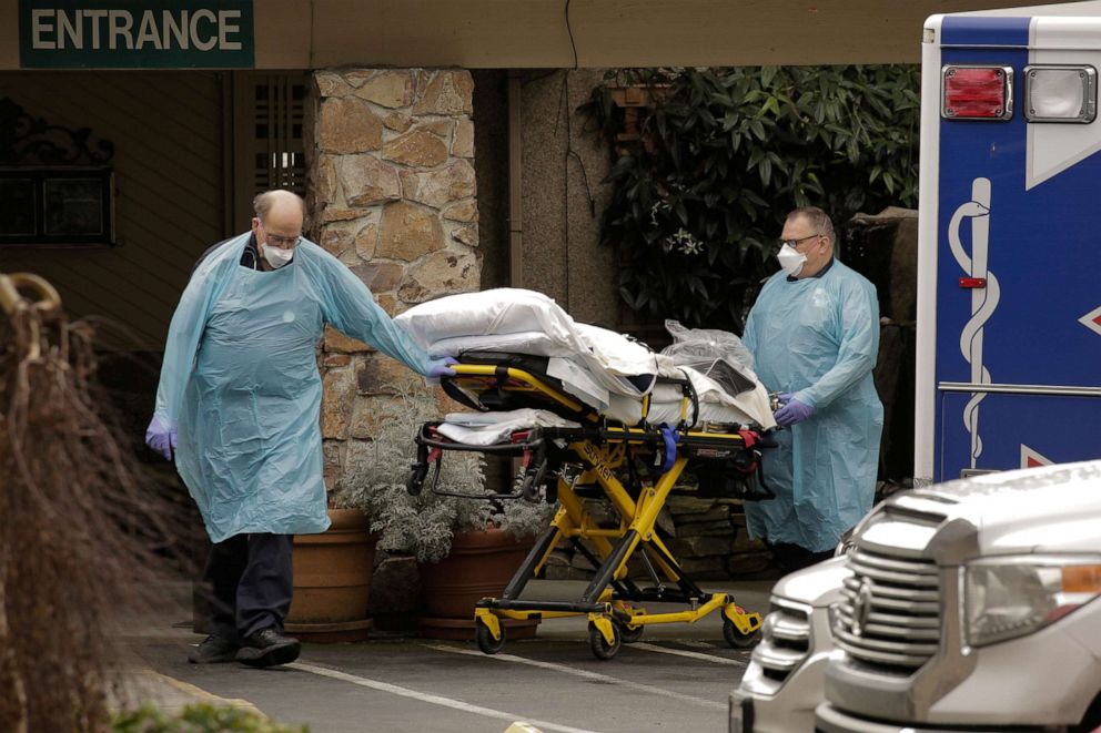 PHOTO: Medics transport a person on a stretcher into an ambulance at the Life Care Center of Kirkland, a long-term care facility linked to several confirmed coronavirus cases, in Kirkland, Washington, March 3, 2020.