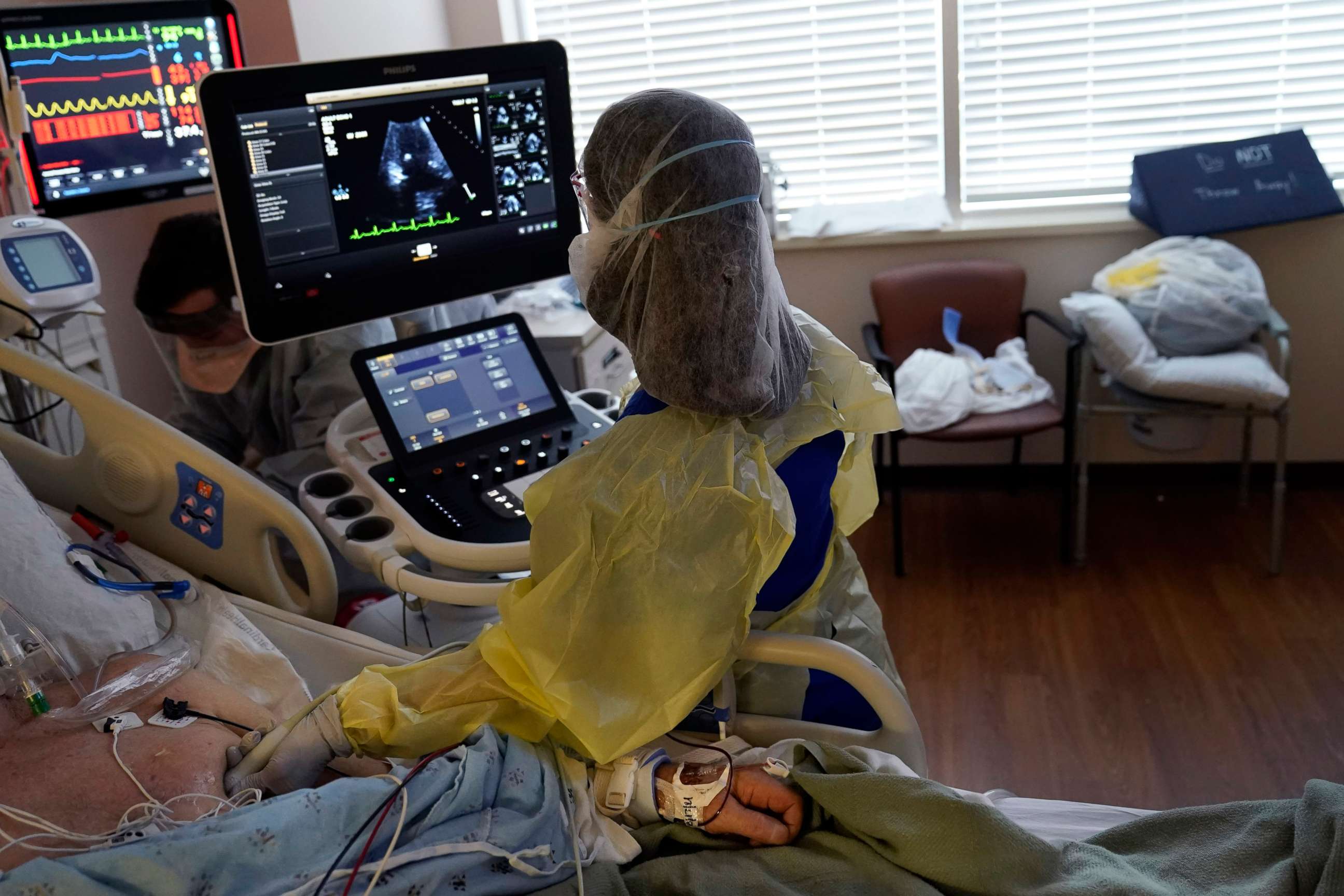 PHOTO: Tracy Brooks, an echocardiogram technician, takes readings from a critically ill COVID-19 patient, in an intensive care unit at the Willis-Knighton Medical Center in Shreveport, La., Tuesday, Aug. 17, 2021.