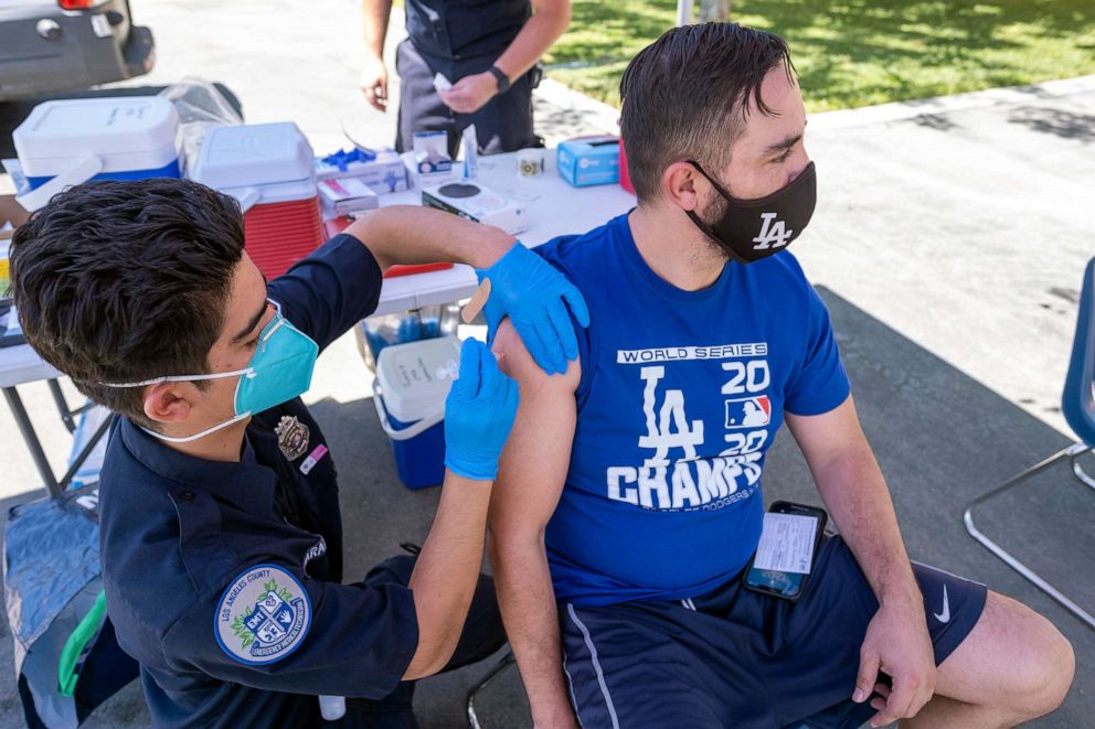 PHOTO: Francisco Arechiga gets a COVID-19 vaccination from EMT Brandon Jaramillo at a pop up clinic in Arleta, Calif., Aug. 2, 2021.